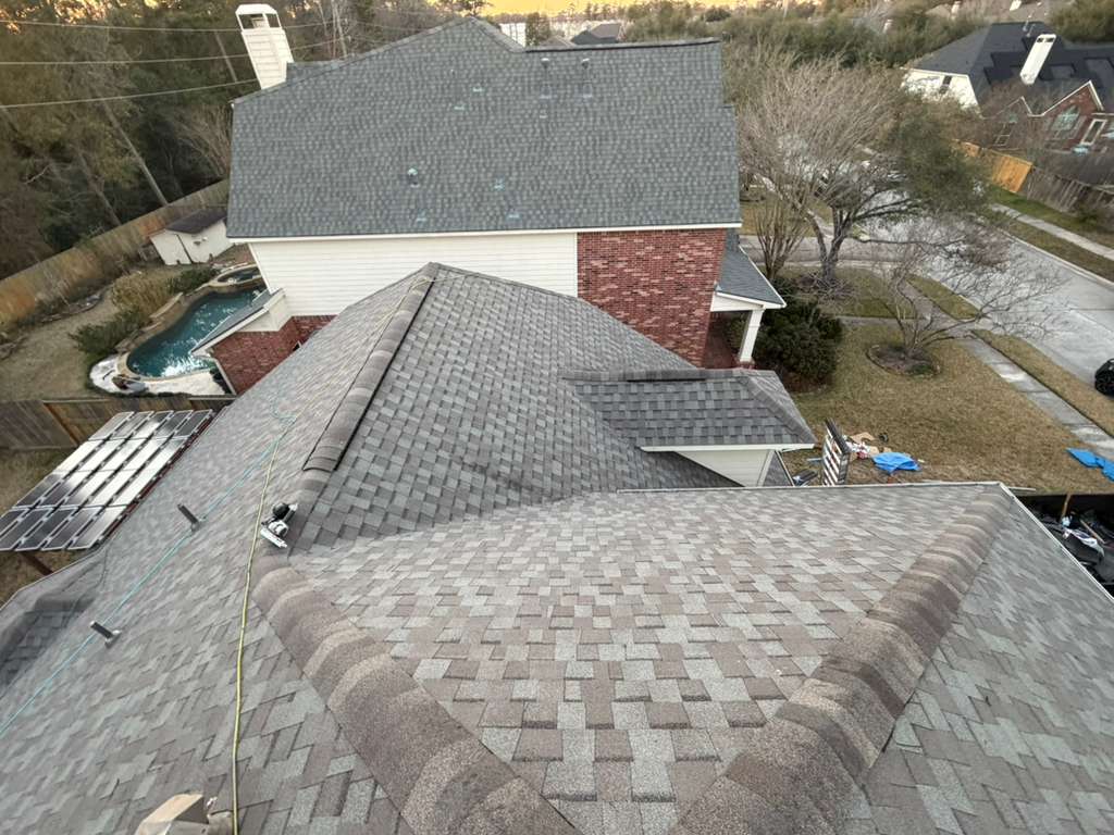 Newly installed asphalt shingle roof on a Houston home