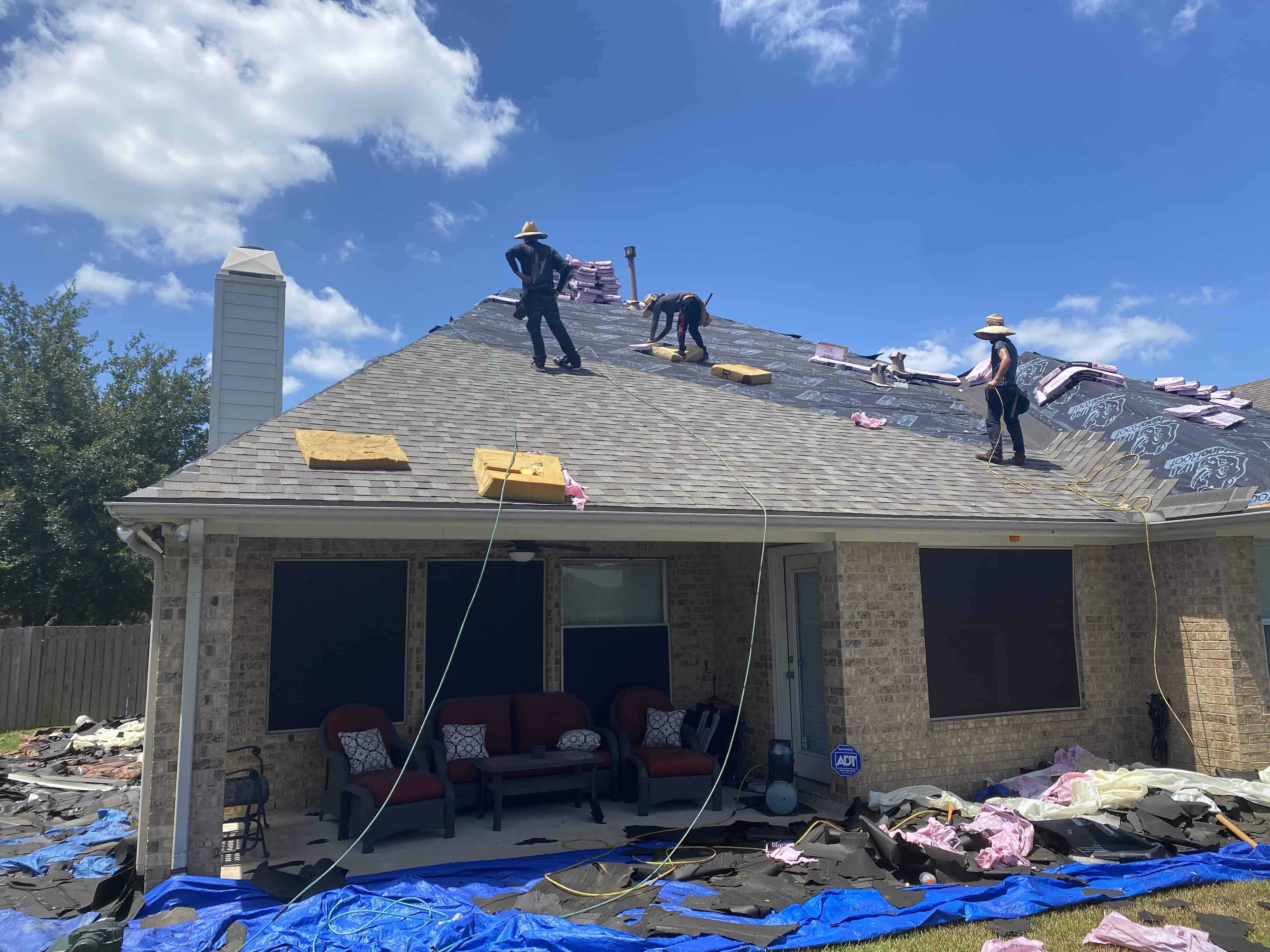 New asphalt shingle roof on a Houston home with fresh flashing at the wall