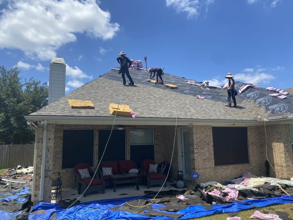 crew of men working on installing a new roof